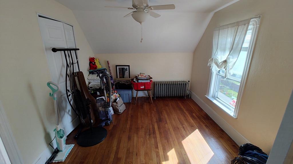 46 Irving Street Everett, MA 02149 - Photo 34 of 42 a view of a hallway with wooden floor and windows
