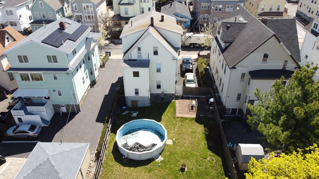 46 Irving Street Everett, MA 02149 - Photo 4 of 42 a aerial view of a house with swimming pool and furniture