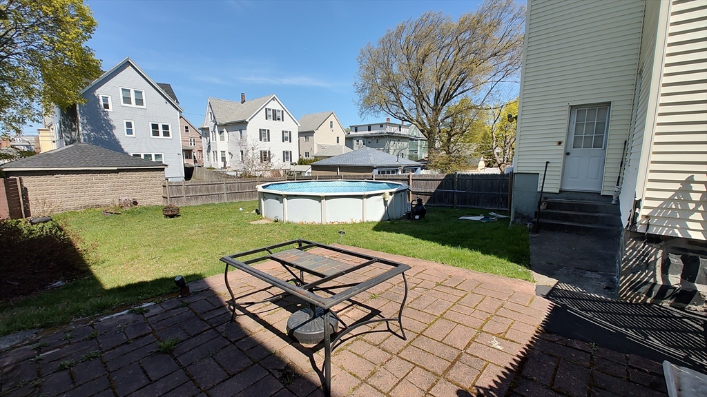 46 Irving Street Everett, MA 02149 - Photo 6 of 42 a view of a house with backyard porch and sitting area