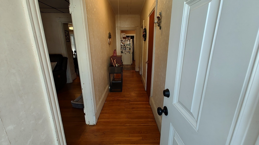 46 Irving Street Everett, MA 02149 - Photo 7 of 42 a view of a hallway with a door