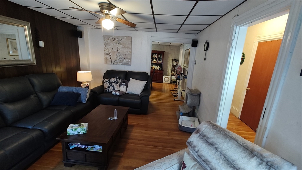 46 Irving Street Everett, MA 02149 - Photo 9 of 42 a living room with furniture and a window