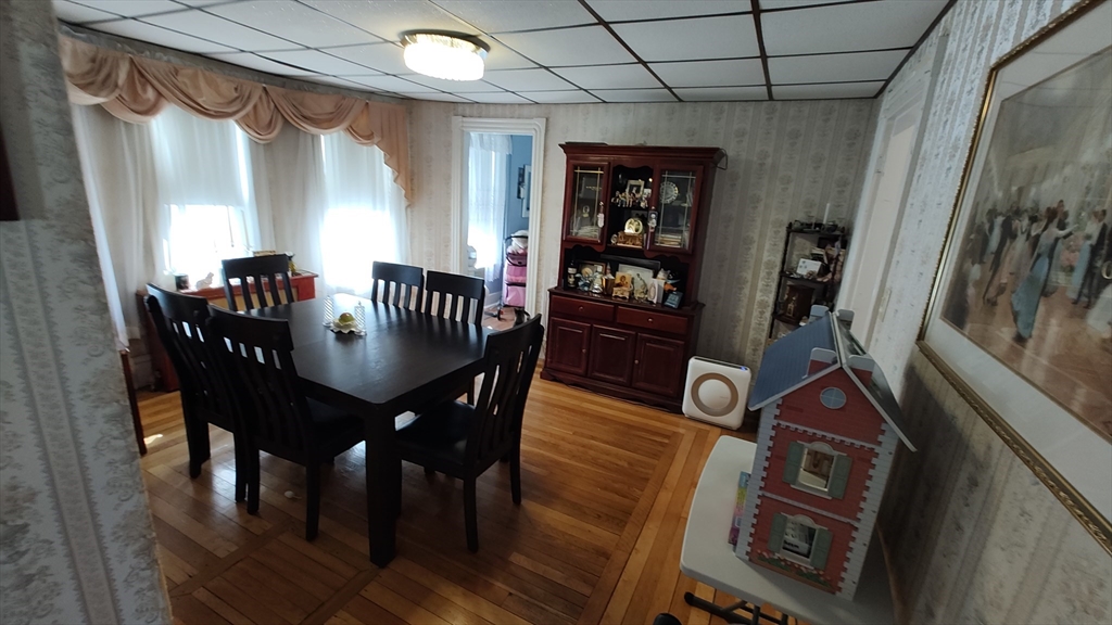 46 Irving Street Everett, MA 02149 - Photo 10 of 42 a view of a dining room with furniture and wooden floor