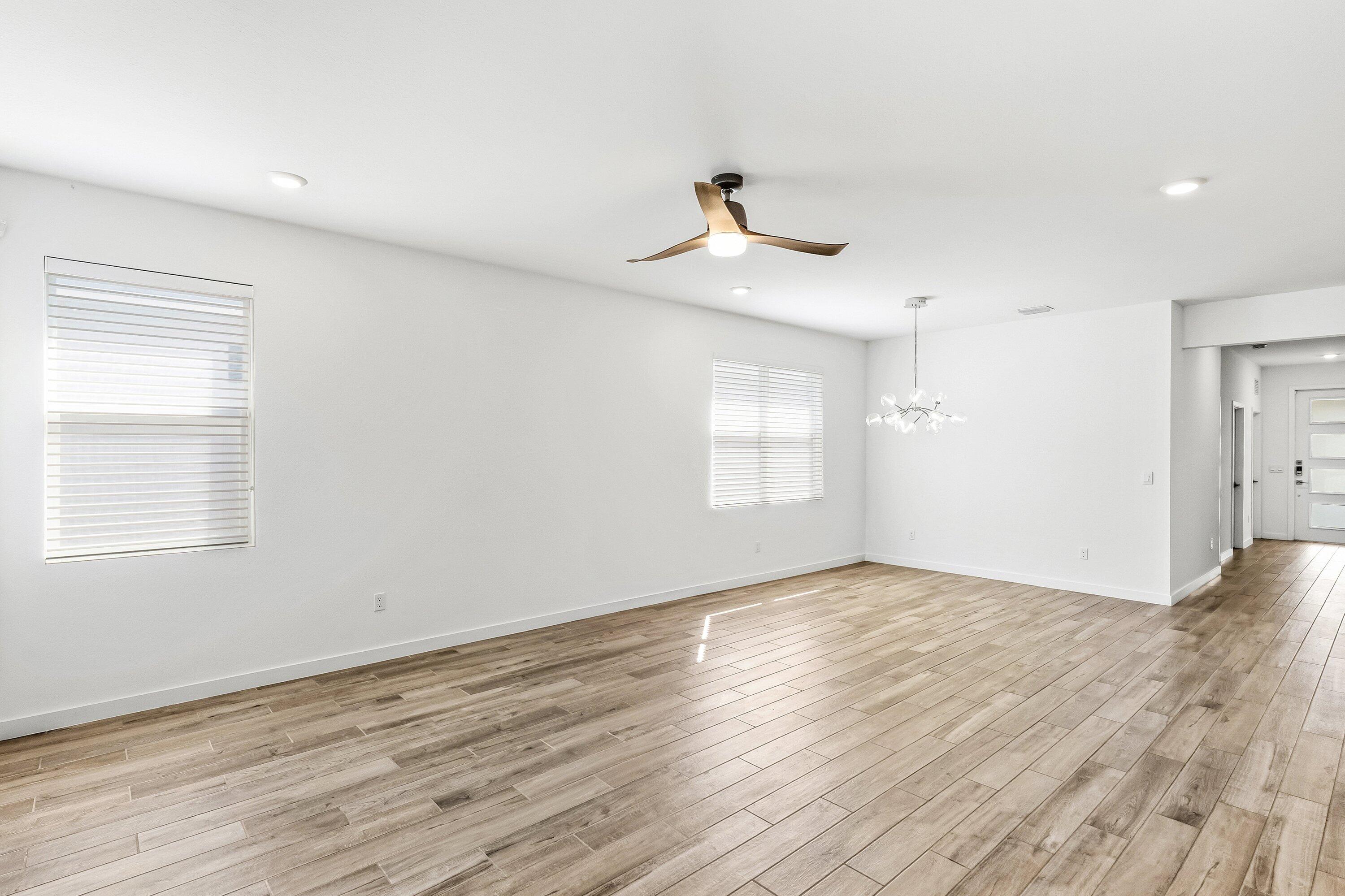 18446 Claybrook Street Jupiter, FL 33458 - Photo 8 of 25 wooden floor in an empty room with a window