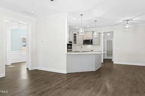 a view of kitchen with wooden floor