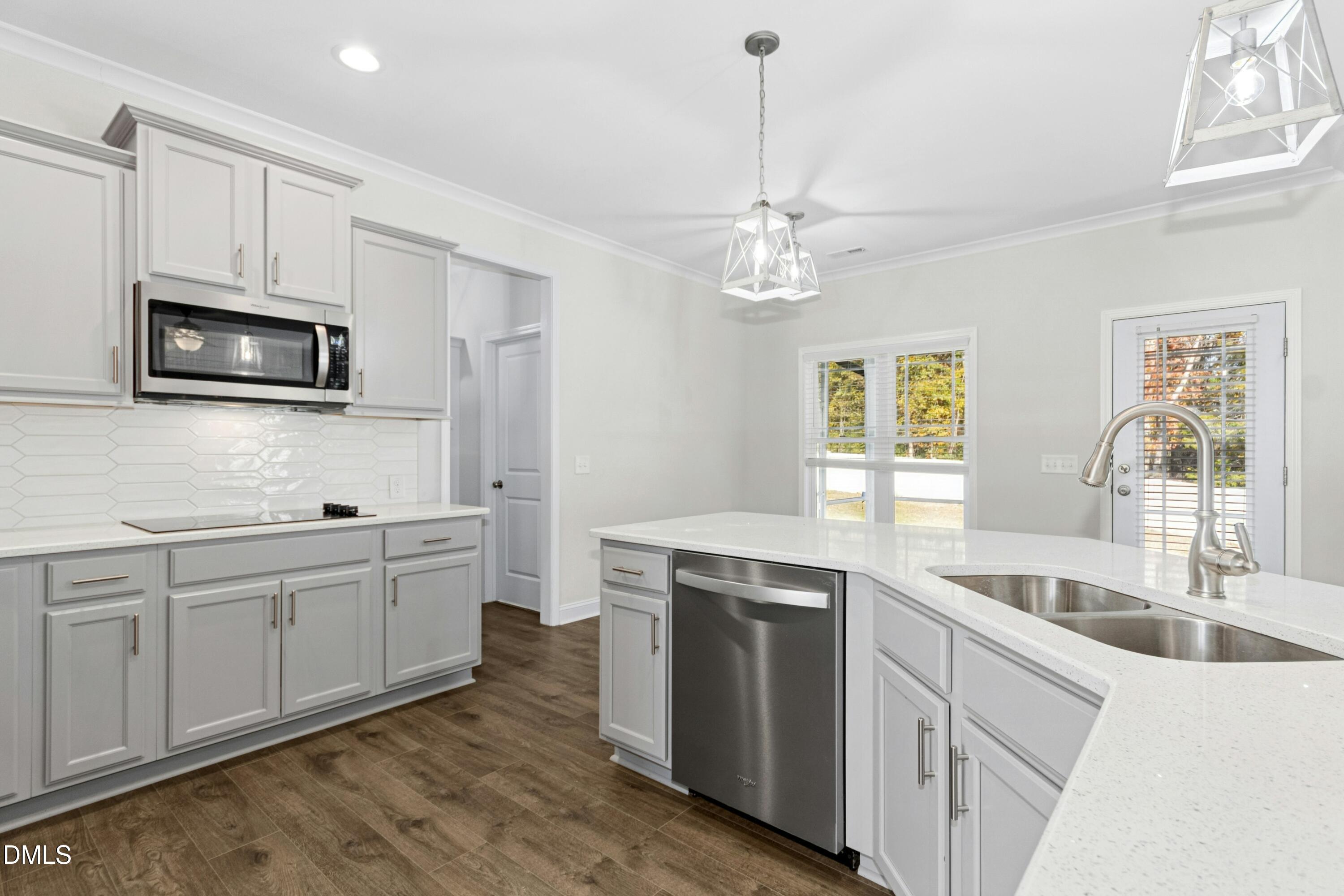 601 Joseph Alexander Drive Fuquay-Varina, NC 27526 - Photo 13 of 39 a kitchen with a sink stove and microwave