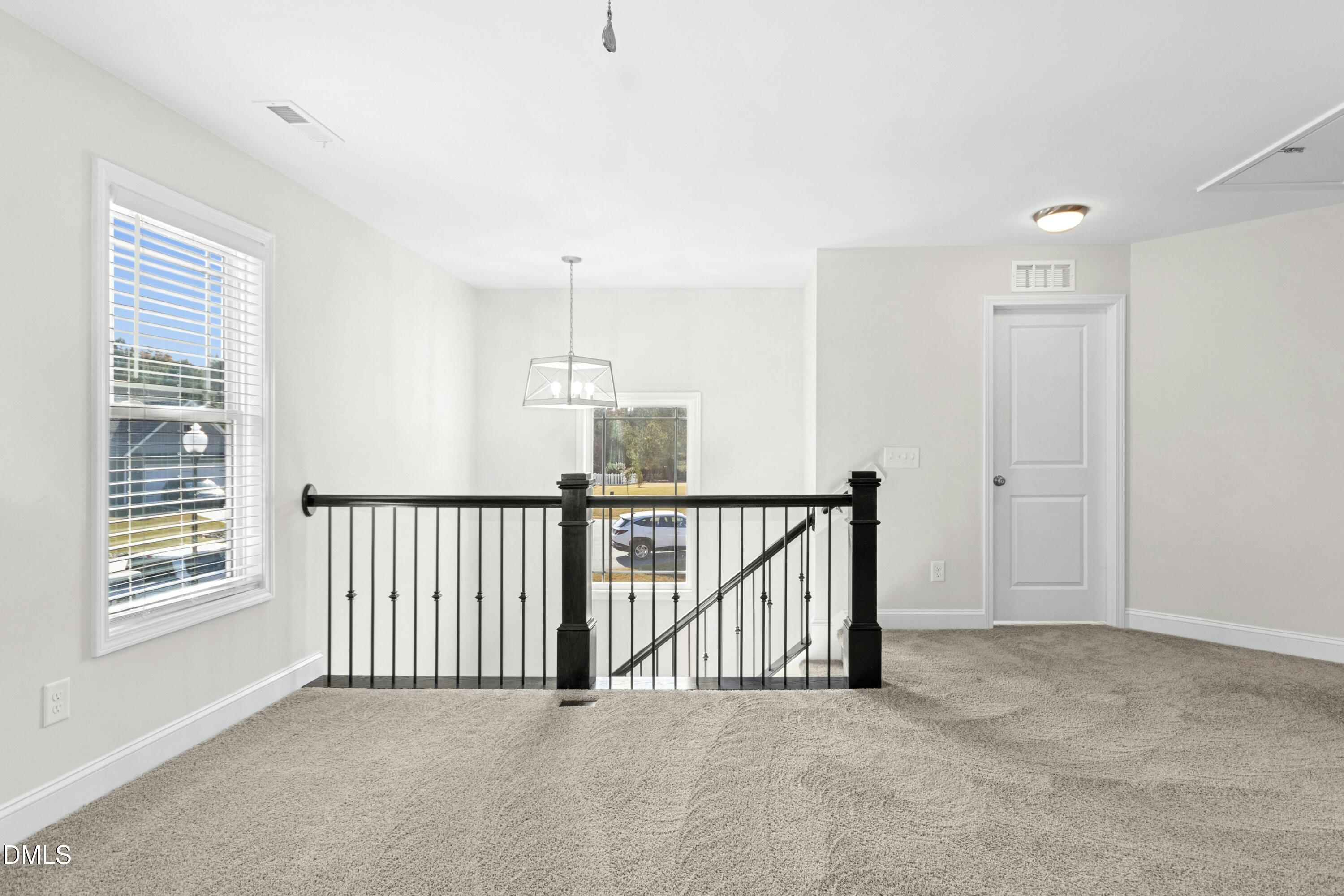 601 Joseph Alexander Drive Fuquay-Varina, NC 27526 - Photo 17 of 39 a view of a hallway with window