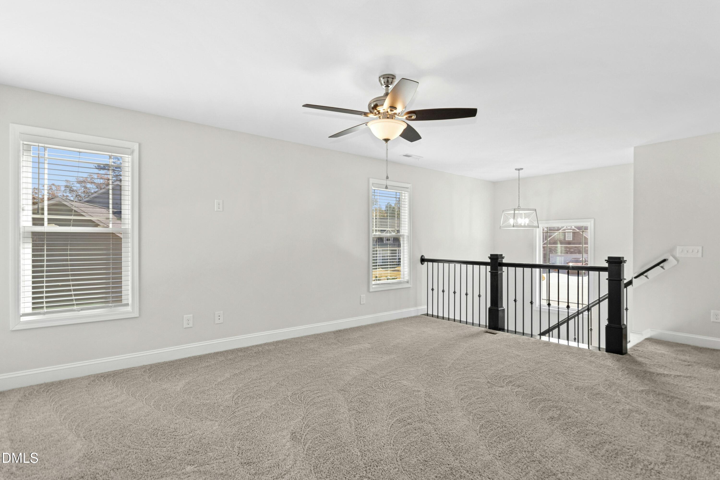 601 Joseph Alexander Drive Fuquay-Varina, NC 27526 - Photo 19 of 39 a view of a livingroom with a ceiling fan and window