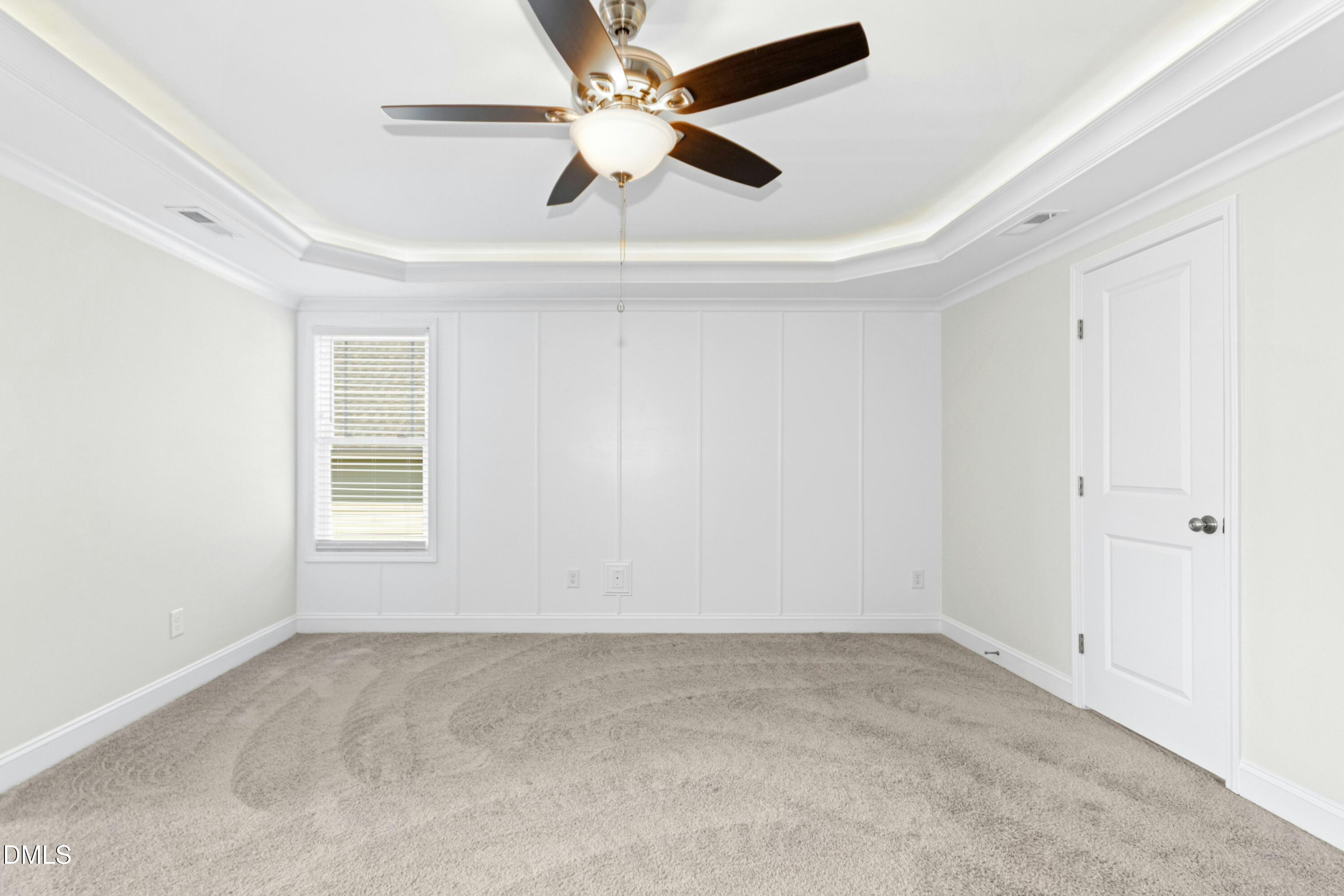 601 Joseph Alexander Drive Fuquay-Varina, NC 27526 - Photo 21 of 39 an empty room with a window and a ceiling fan