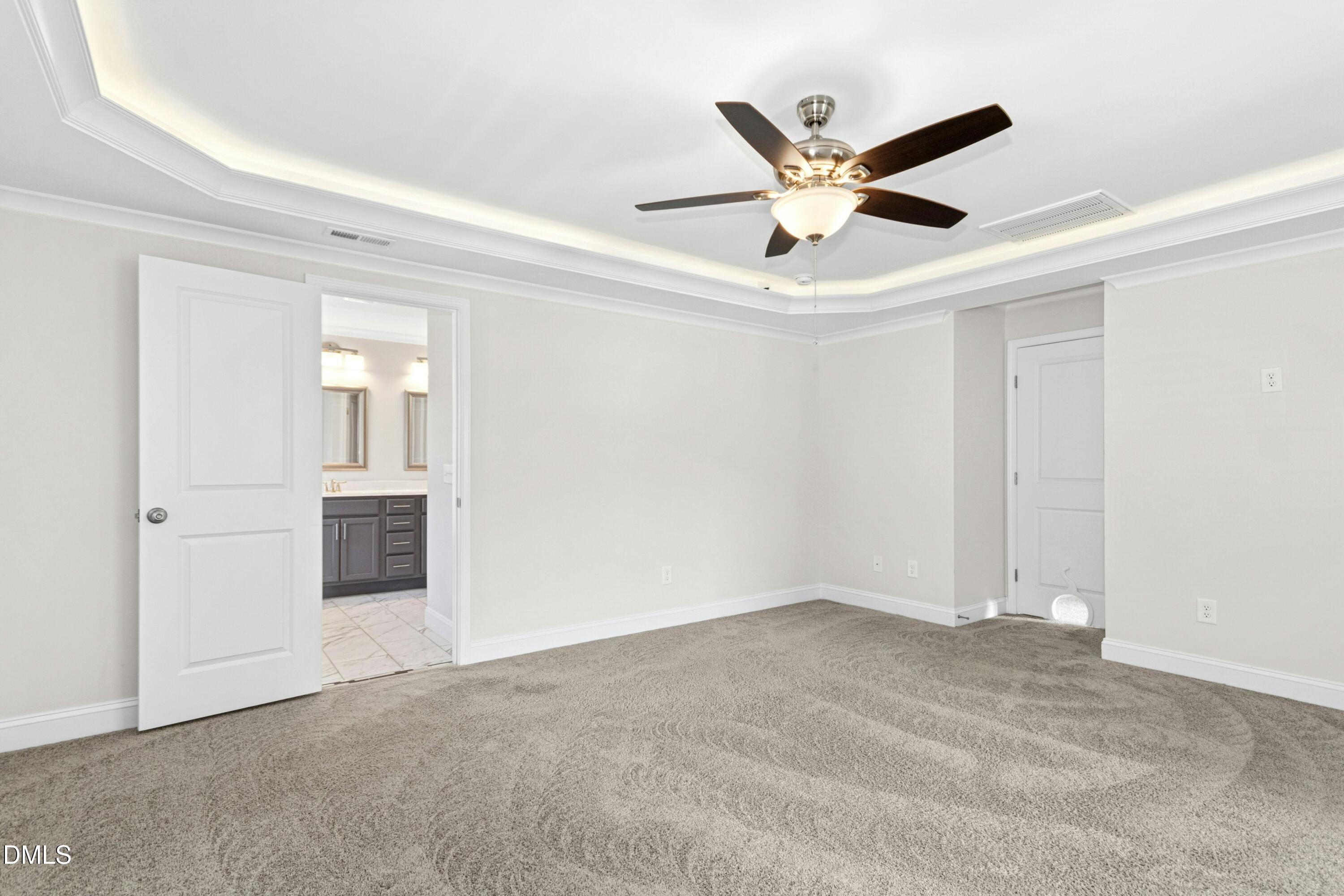 601 Joseph Alexander Drive Fuquay-Varina, NC 27526 - Photo 24 of 39 a view of an empty room with a ceiling fan