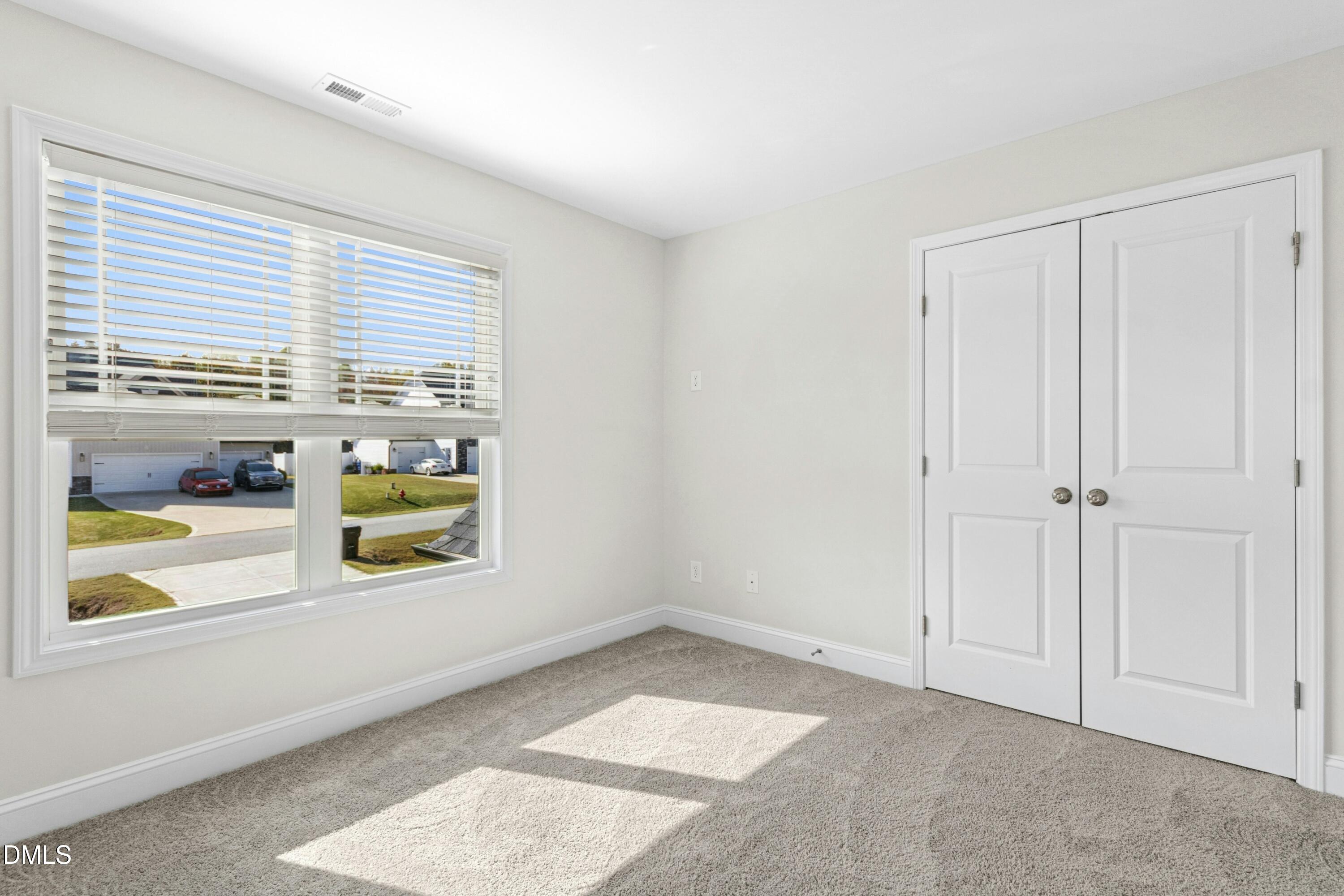 601 Joseph Alexander Drive Fuquay-Varina, NC 27526 - Photo 28 of 39 a view of an empty room and window