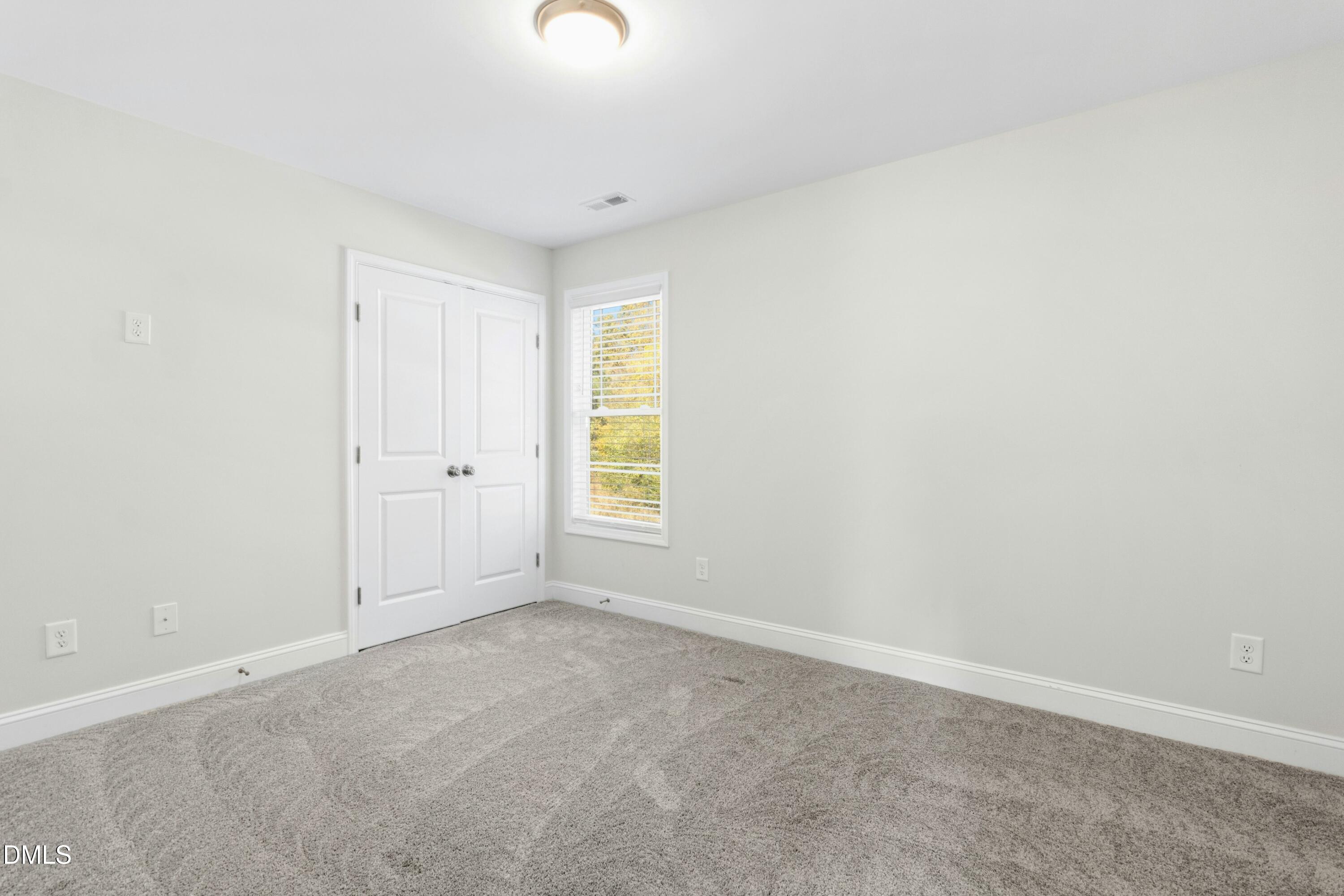 601 Joseph Alexander Drive Fuquay-Varina, NC 27526 - Photo 30 of 39 an empty room with windows