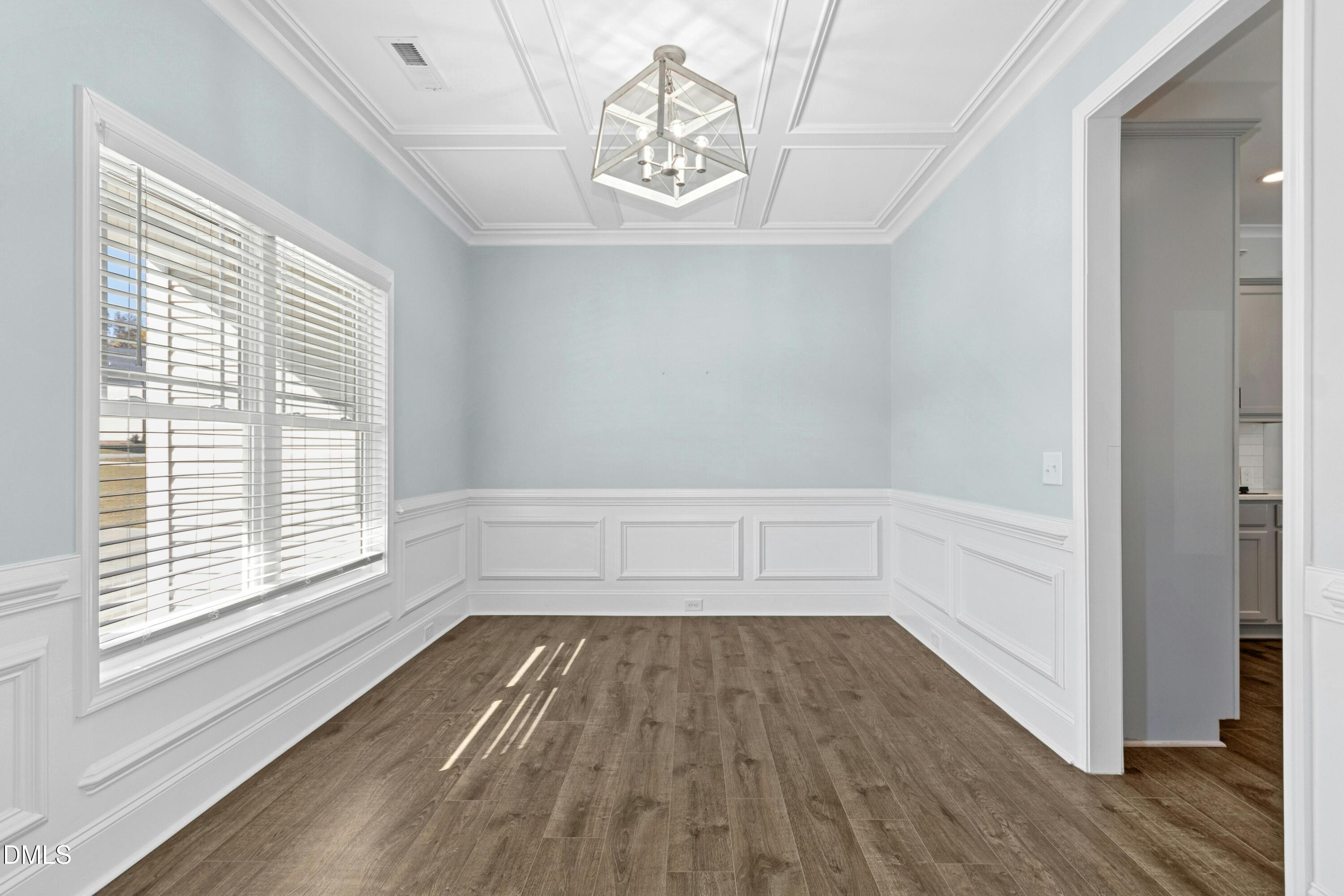 601 Joseph Alexander Drive Fuquay-Varina, NC 27526 - Photo 4 of 39 a view of a room with wooden floor and a window