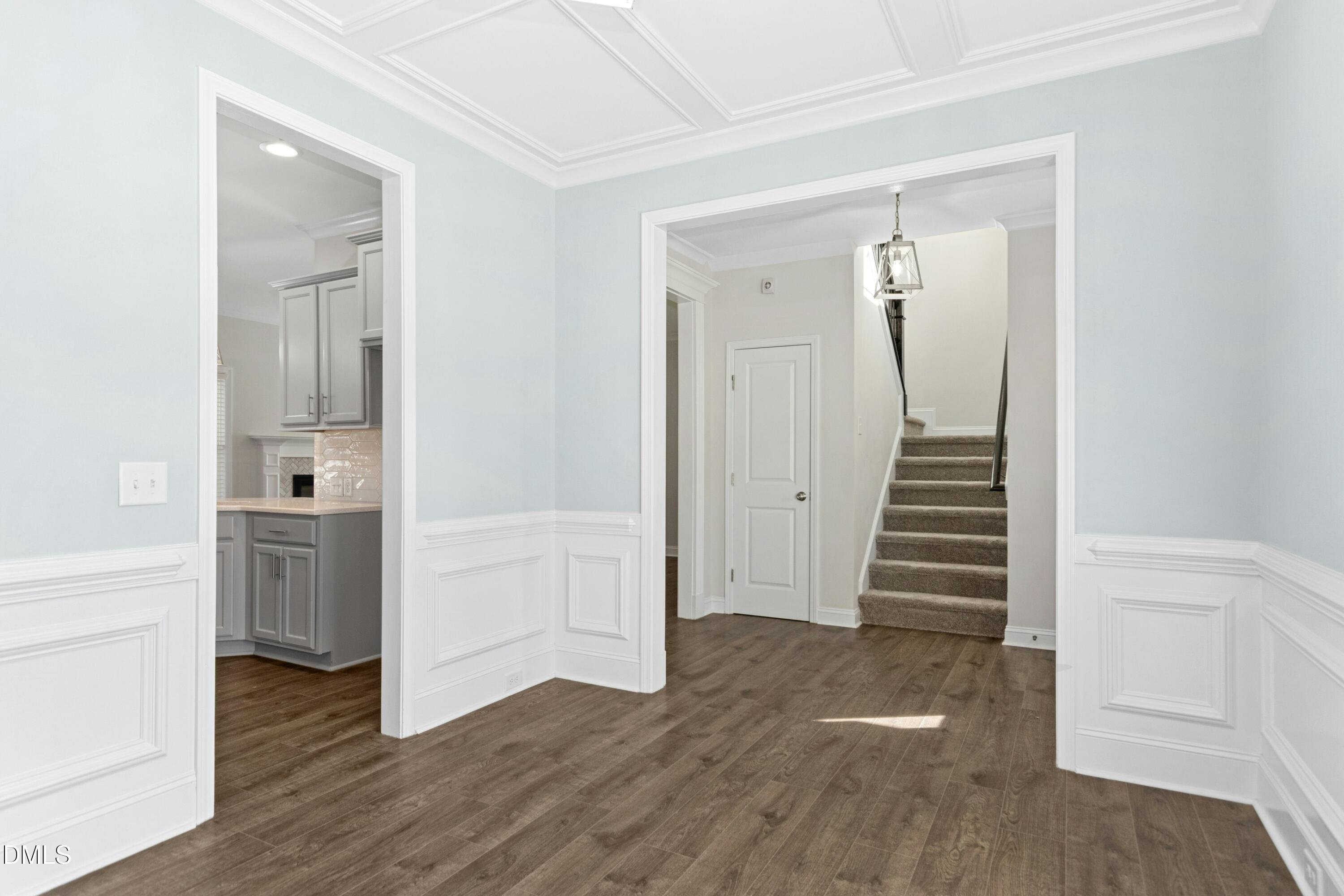 601 Joseph Alexander Drive Fuquay-Varina, NC 27526 - Photo 6 of 39 a view of a hallway with wooden floor and entryway