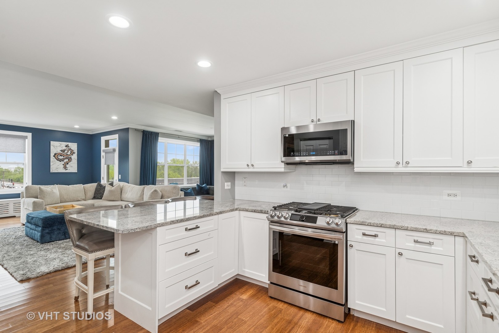 970 Harris Road, Unit 33 Grayslake, IL 60030 - Photo 9 of 24 a kitchen with granite countertop white cabinets and white appliances