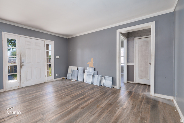 330 West 600th Street South Provo, UT 84601 - Photo 7 of 26 Entryway featuring wood-finish flooring, a white paneled door with sidelights, and gray painted walls