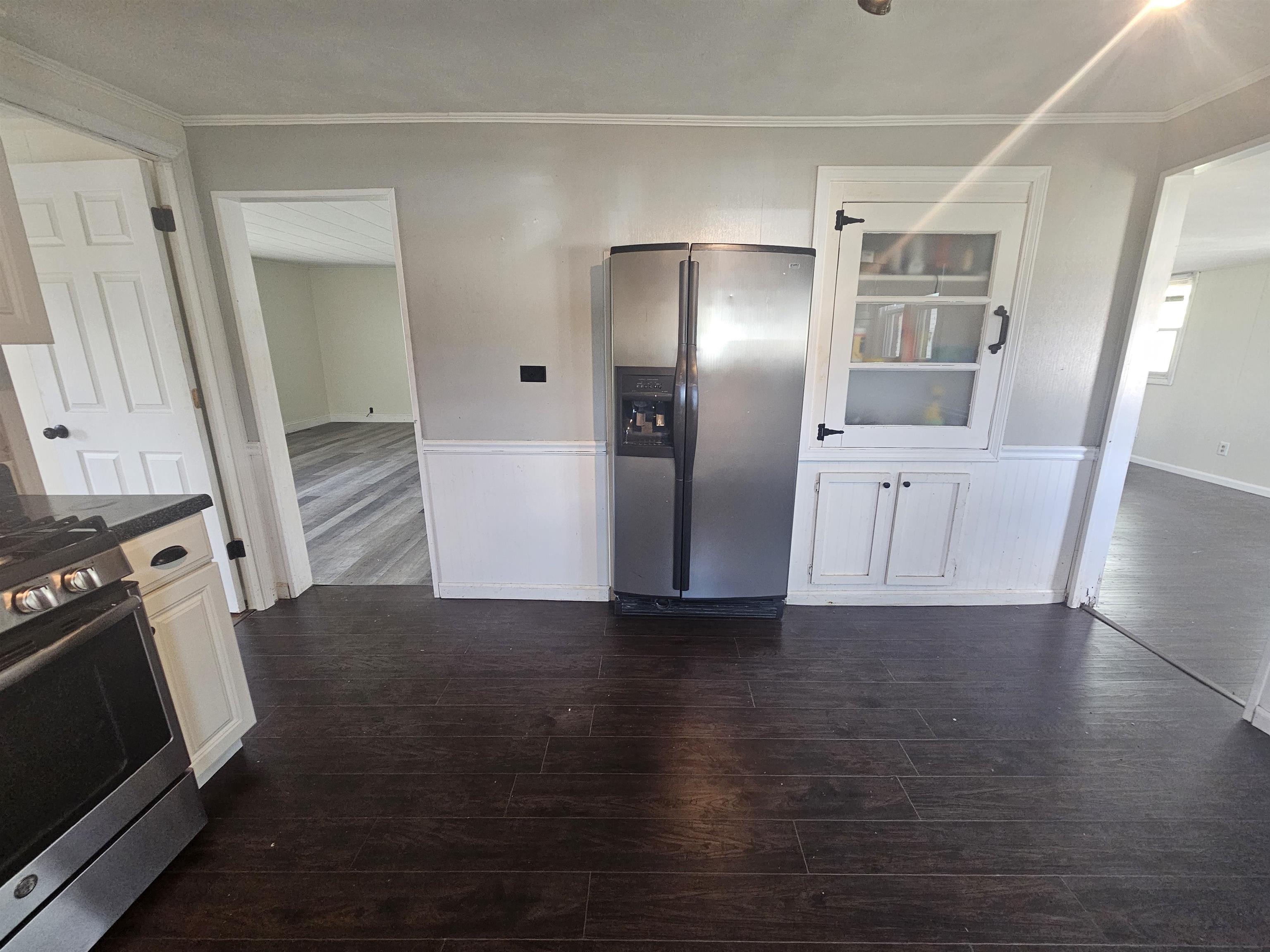 11115 Lamaster Road Marion, IL 62959 - Photo 11 of 26 a view of a kitchen with wooden floors and electronic appliances