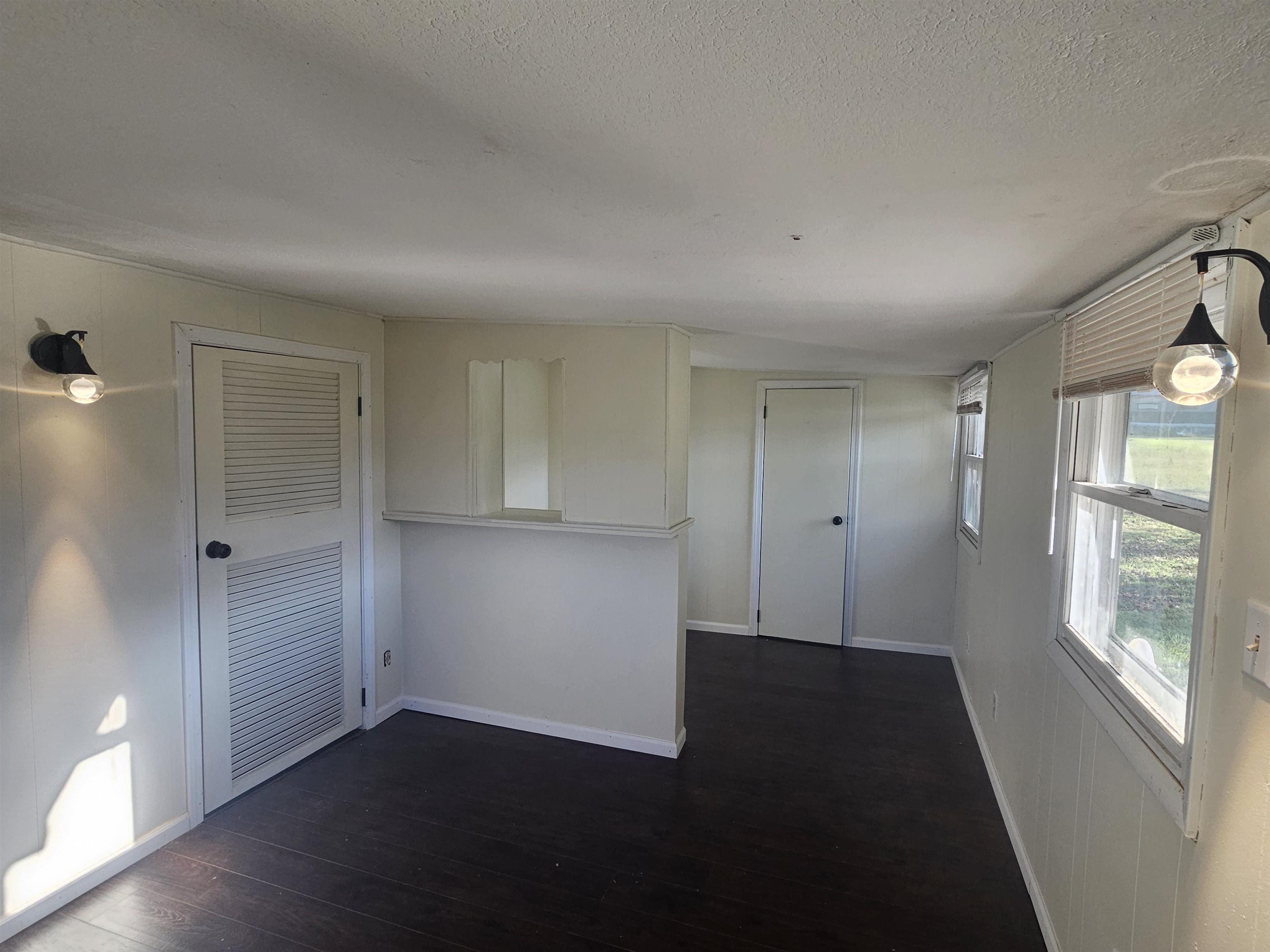 11115 Lamaster Road Marion, IL 62959 - Photo 16 of 26 a view of an empty room with wooden floor and a window