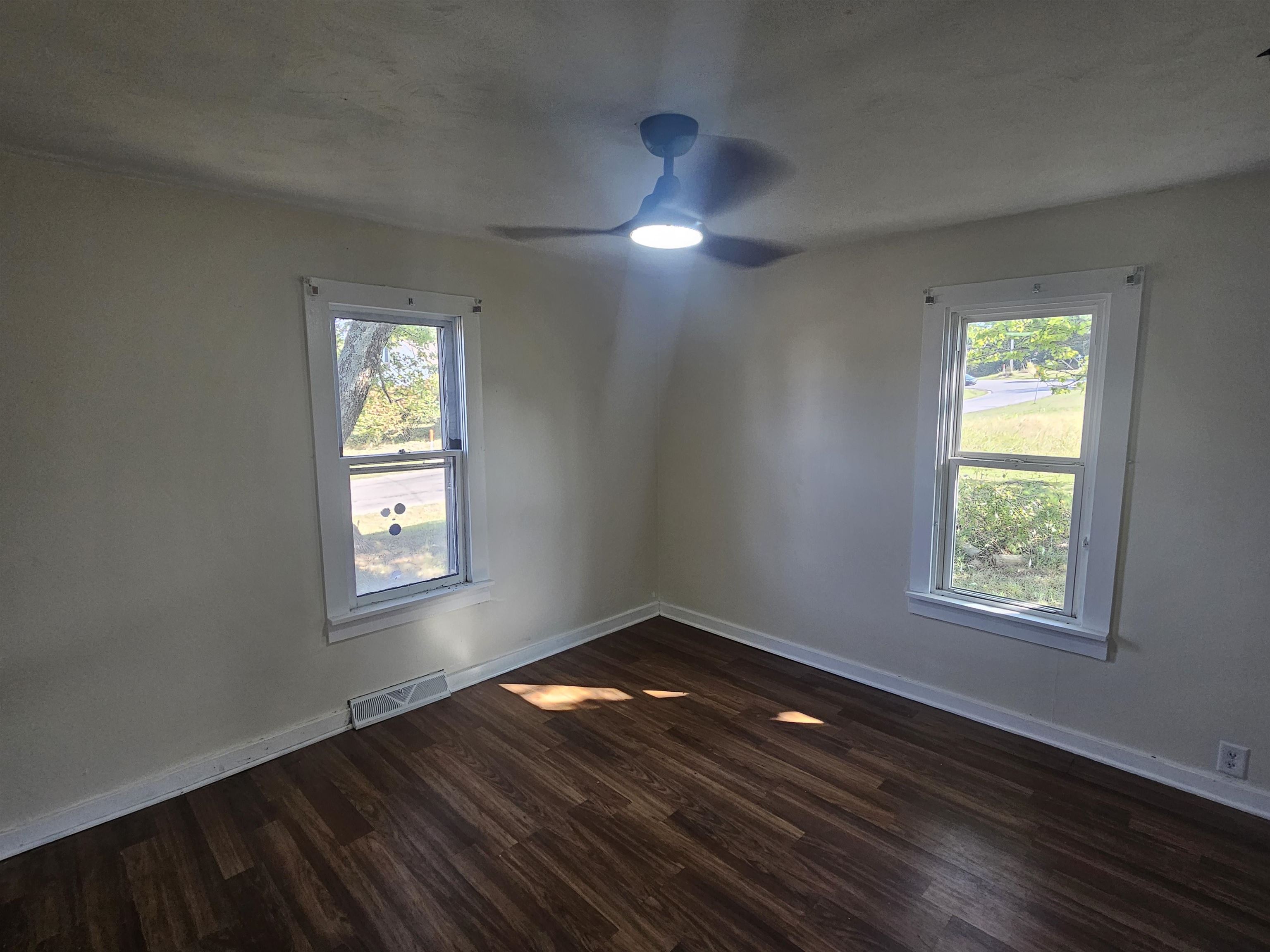 11115 Lamaster Road Marion, IL 62959 - Photo 23 of 26 a view of an empty room with wooden floor and a window