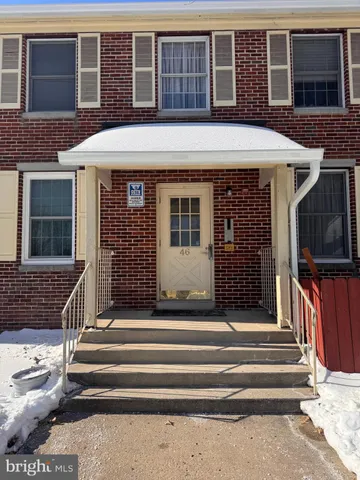 a front view of a house with a porch