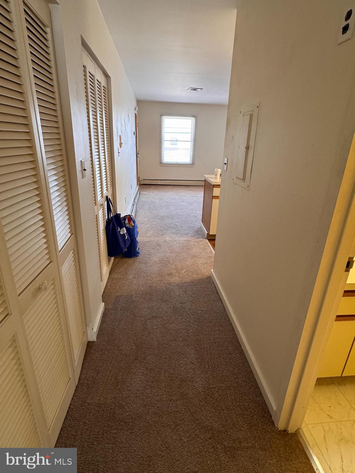 46 Buttonwood Street, Unit C Mount Holly, NJ 08060 - Photo 12 of 14 a view of hallway with furniture and a window