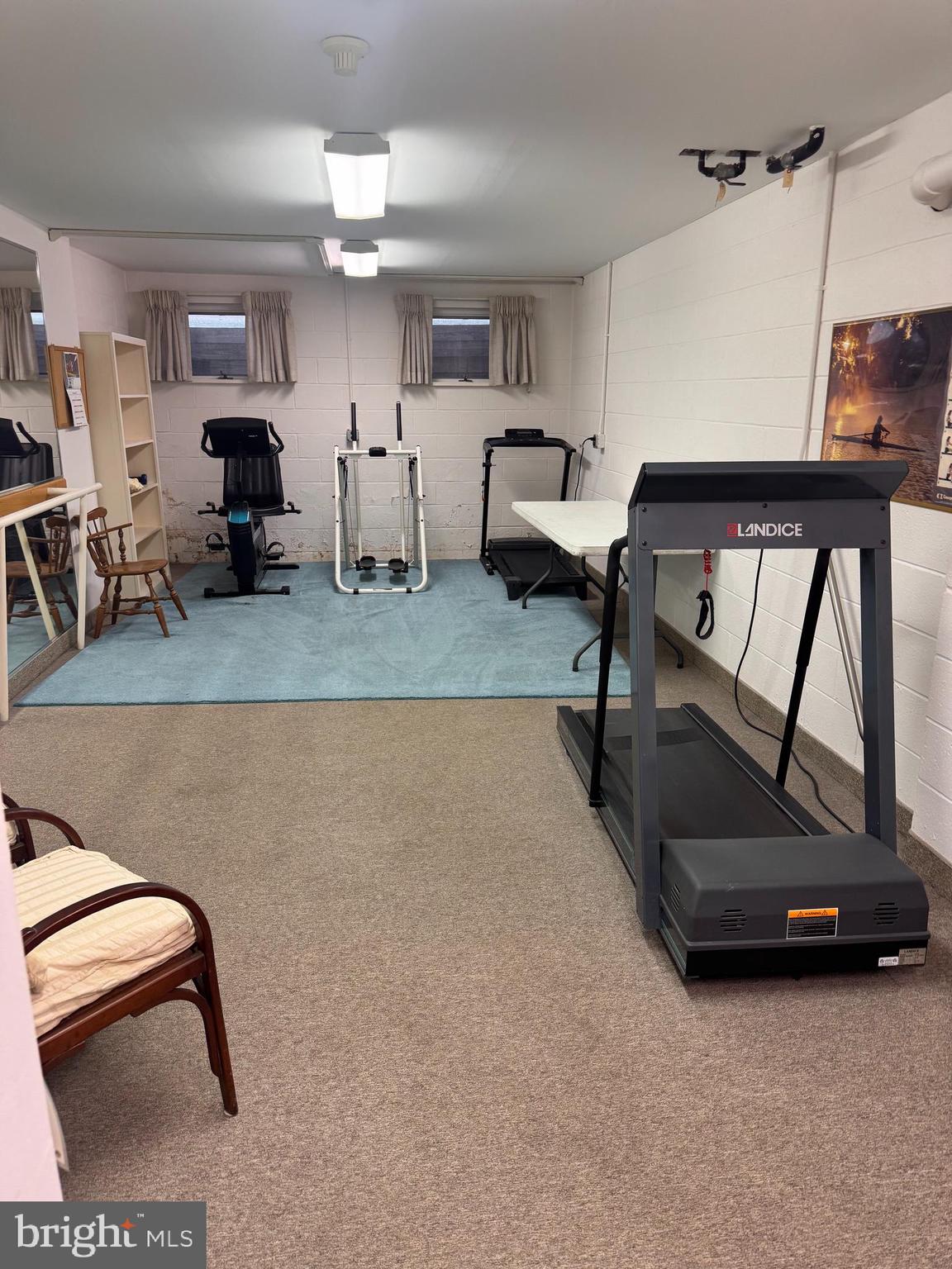 46 Buttonwood Street, Unit C Mount Holly, NJ 08060 - Photo 14 of 14 a room with gym equipment and a large window