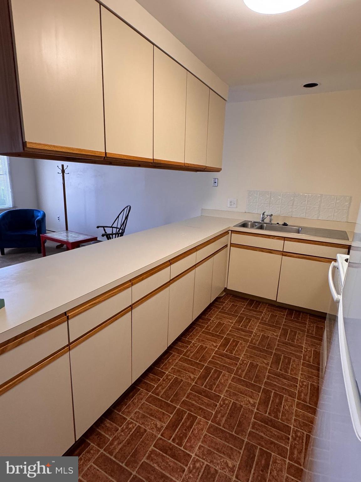 46 Buttonwood Street, Unit C Mount Holly, NJ 08060 - Photo 7 of 14 a kitchen with a sink and cabinets