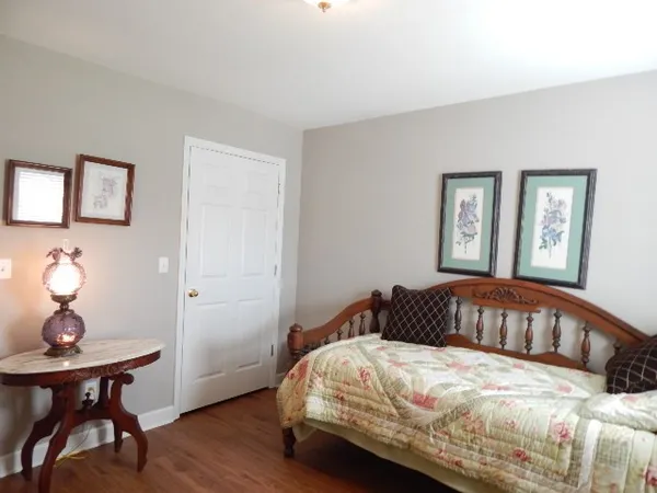 a bedroom with a bed and a table