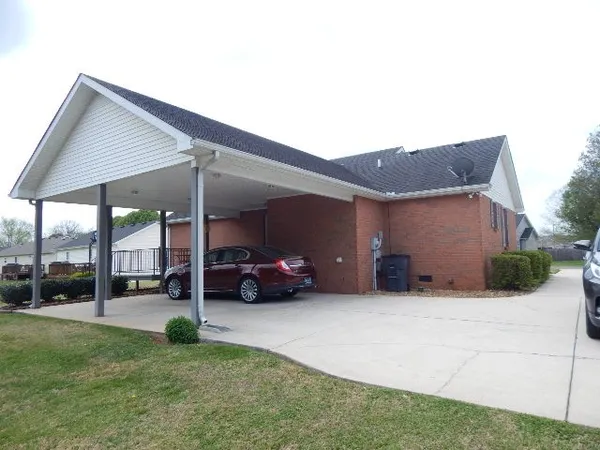 a view of a house with a cars park