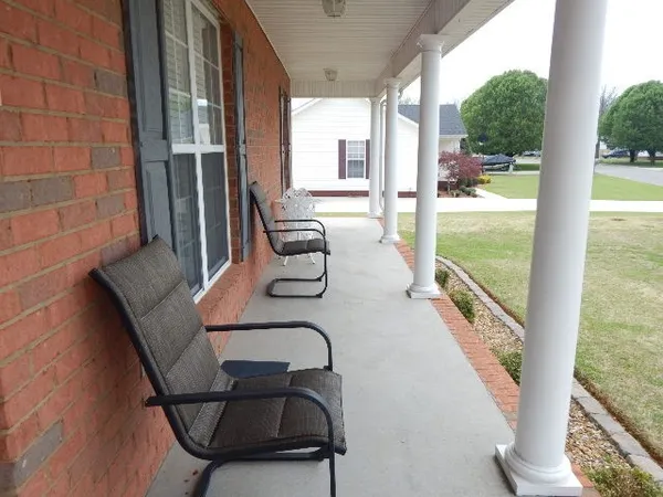 a balcony with chairs