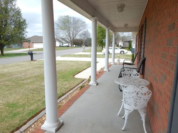 a view of a house with a yard and garage
