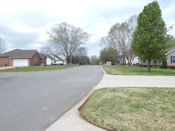 a view of a park with welcome board