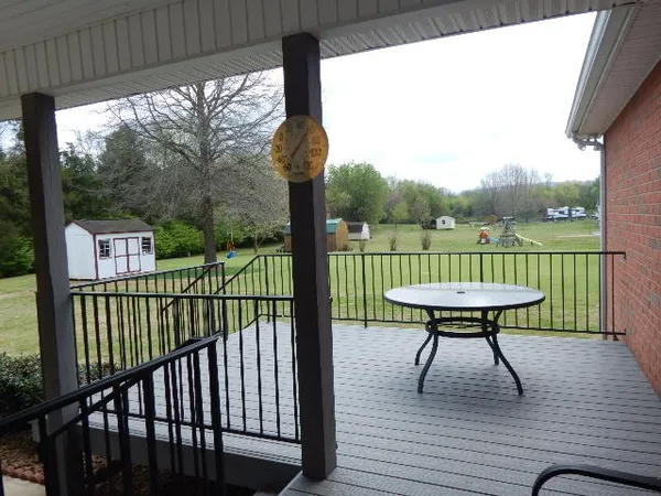 a view of backyard with tub
