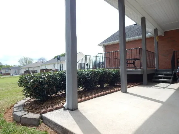a house with trees in the background