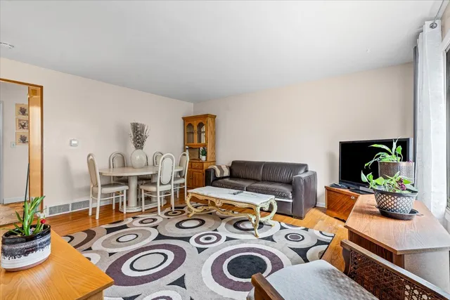 a living room with furniture and a table