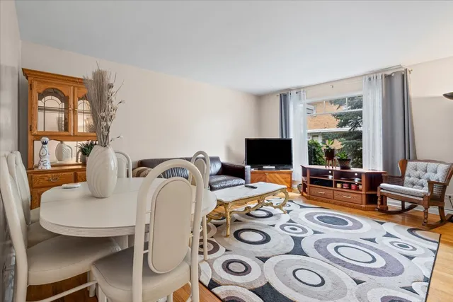 a bedroom with furniture and a flat screen tv