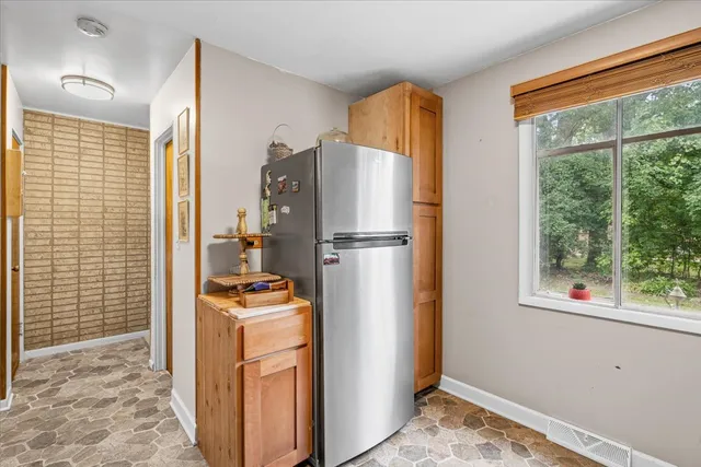 a view of a storage and utility room with a window