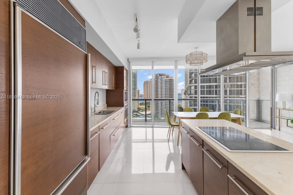 485 Brickell Avenue, Unit 2210 Miami, FL 33131 - Photo 12 of 66 a kitchen with a sink and a refrigerator