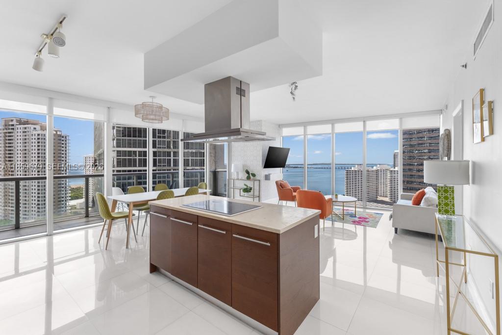 485 Brickell Avenue, Unit 2210 Miami, FL 33131 - Photo 14 of 71 a view of kitchen with stainless steel appliances wooden floor and large windows