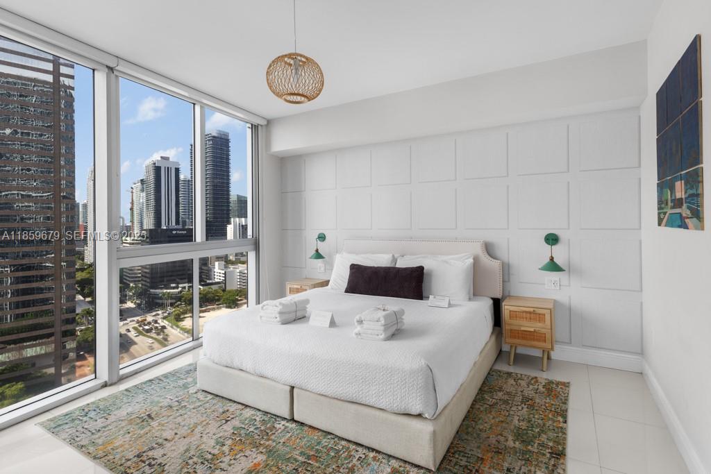 485 Brickell Avenue, Unit 2210 Miami, FL 33131 - Photo 15 of 66 a living room with furniture and a table