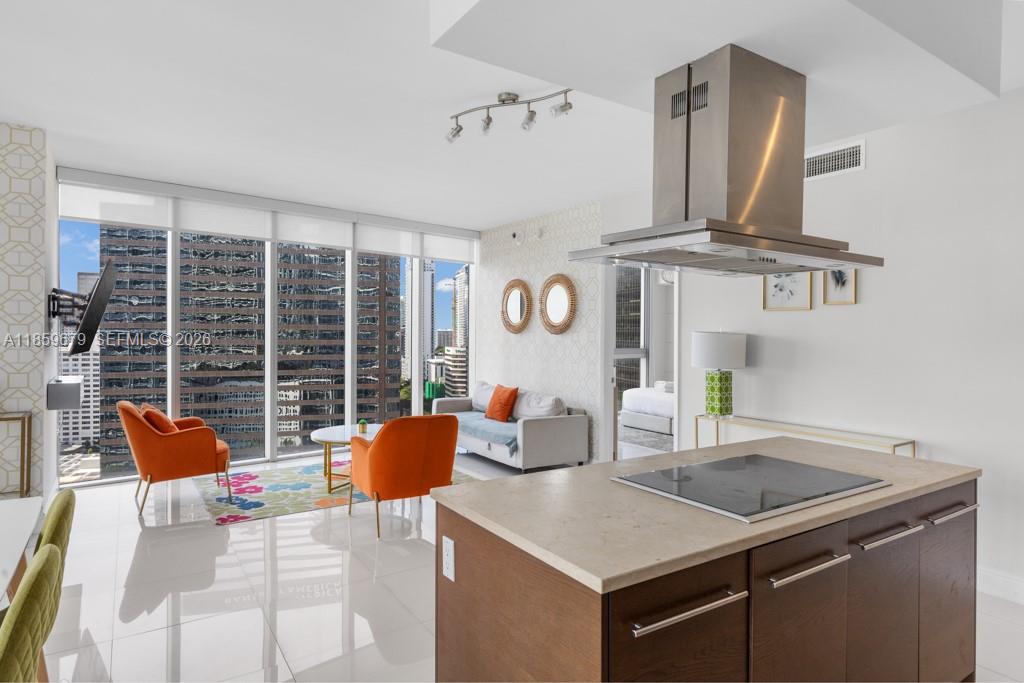 485 Brickell Avenue, Unit 2210 Miami, FL 33131 - Photo 18 of 71 a kitchen with a sink a stove and a refrigerator
