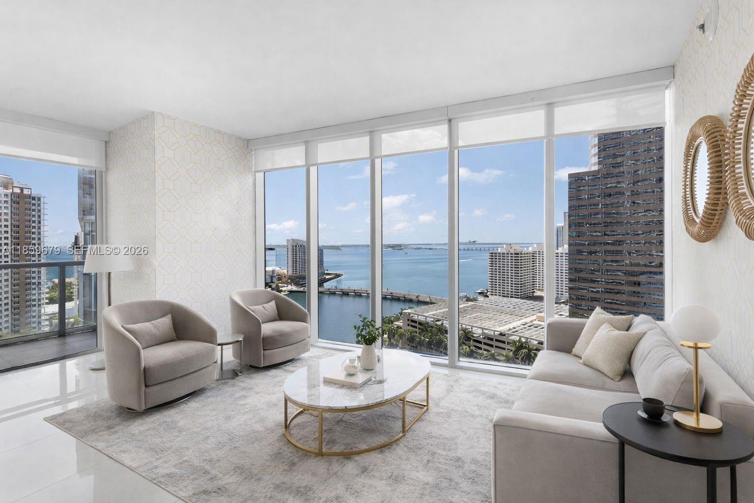 485 Brickell Avenue, Unit 2210 Miami, FL 33131 - Photo 2 of 71 a living room with furniture and a large window