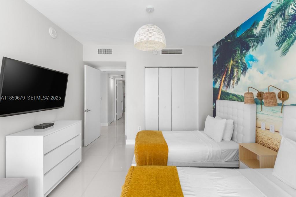 485 Brickell Avenue, Unit 2210 Miami, FL 33131 - Photo 22 of 66 a living room with furniture and a flat screen tv