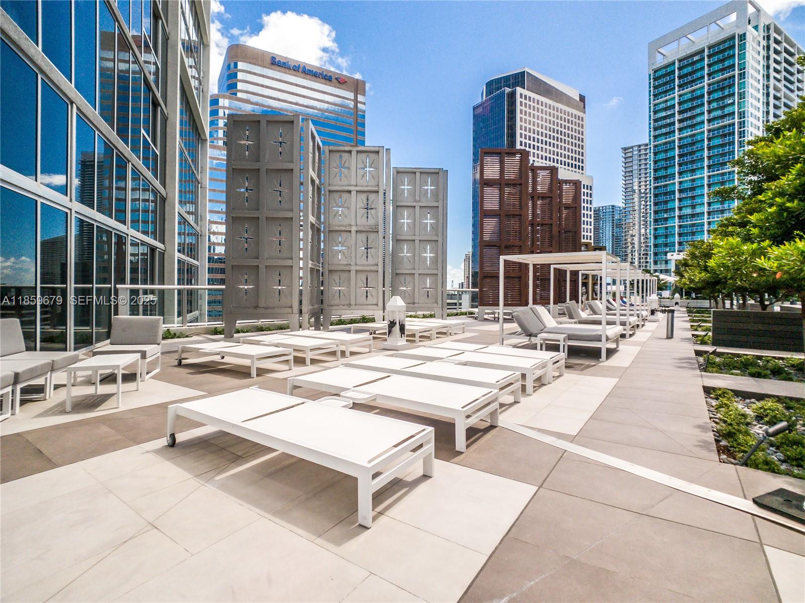 485 Brickell Avenue, Unit 2210 Miami, FL 33131 - Photo 35 of 66 a swimming pool with outdoor seating and a outdoor view