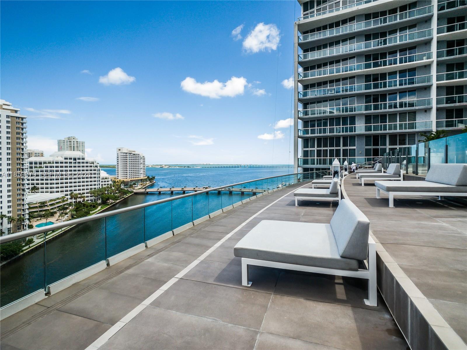 485 Brickell Avenue, Unit 2210 Miami, FL 33131 - Photo 39 of 71 a view of swimming pool with outdoor seating and city view