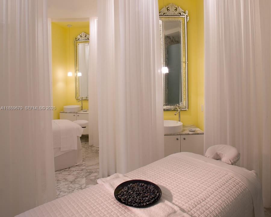 485 Brickell Avenue, Unit 2210 Miami, FL 33131 - Photo 46 of 66 a bathroom with a sink a toilet and mirror