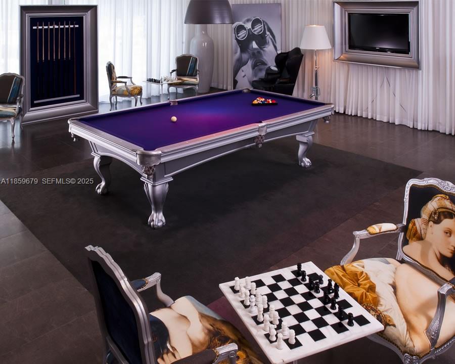 485 Brickell Avenue, Unit 2210 Miami, FL 33131 - Photo 48 of 66 a room with furniture and wooden floor