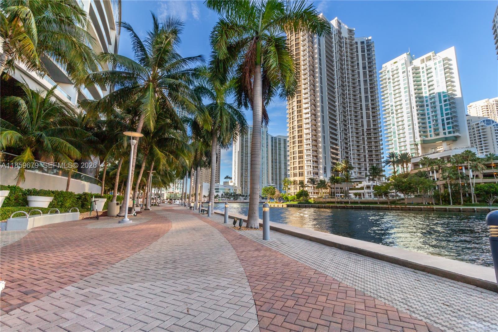 485 Brickell Avenue, Unit 2210 Miami, FL 33131 - Photo 60 of 71 a row of palm trees in front of house