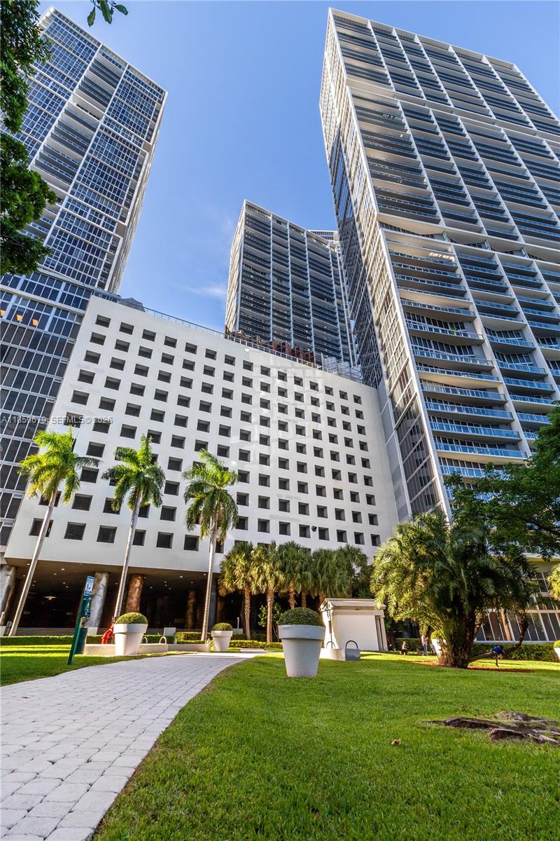 485 Brickell Avenue, Unit 2210 Miami, FL 33131 - Photo 67 of 71 a front view of a building with garden