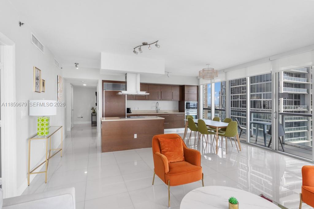 485 Brickell Avenue, Unit 2210 Miami, FL 33131 - Photo 8 of 71 a living room with furniture and a table