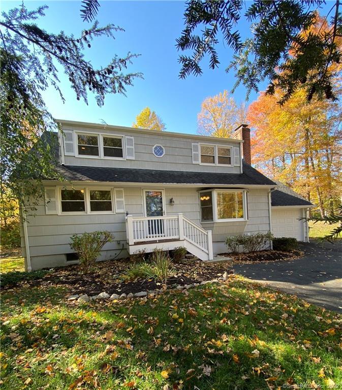 309 Limestone Road Ridgefield, CT 06877 - Photo 1 of 1 a front view of a house with a yard